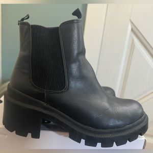 Size 6.5 black vegan leather lug boots.
